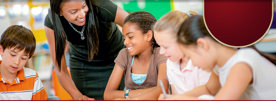 A teacher happily works with her middle school students